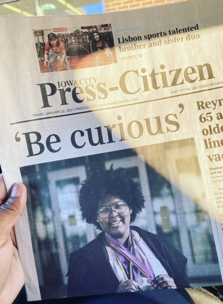 Iowa City Press-Citizen article showing an image of Dasia with the title "Be Curious"