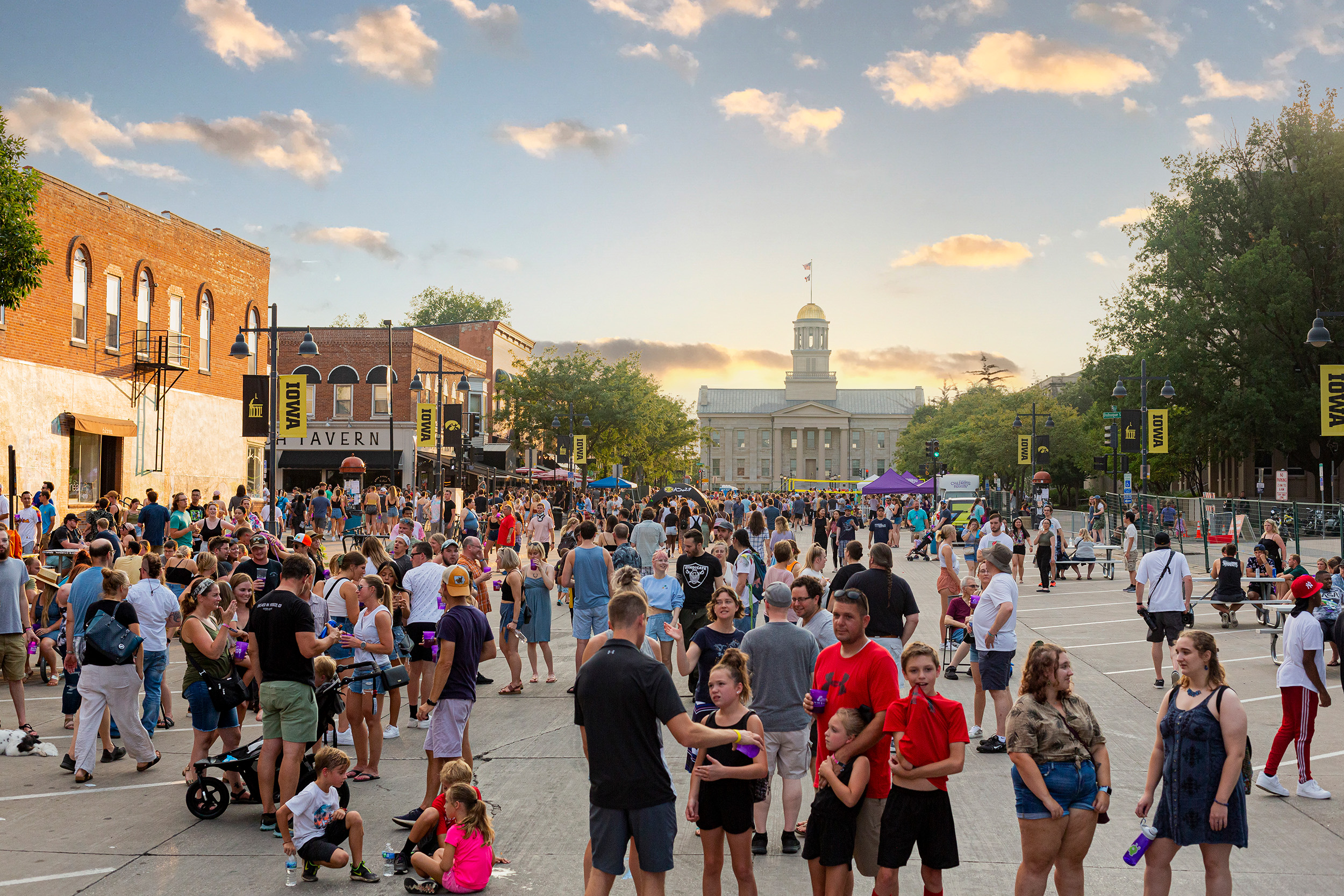 crowd of people at downtown Iowa city block party event