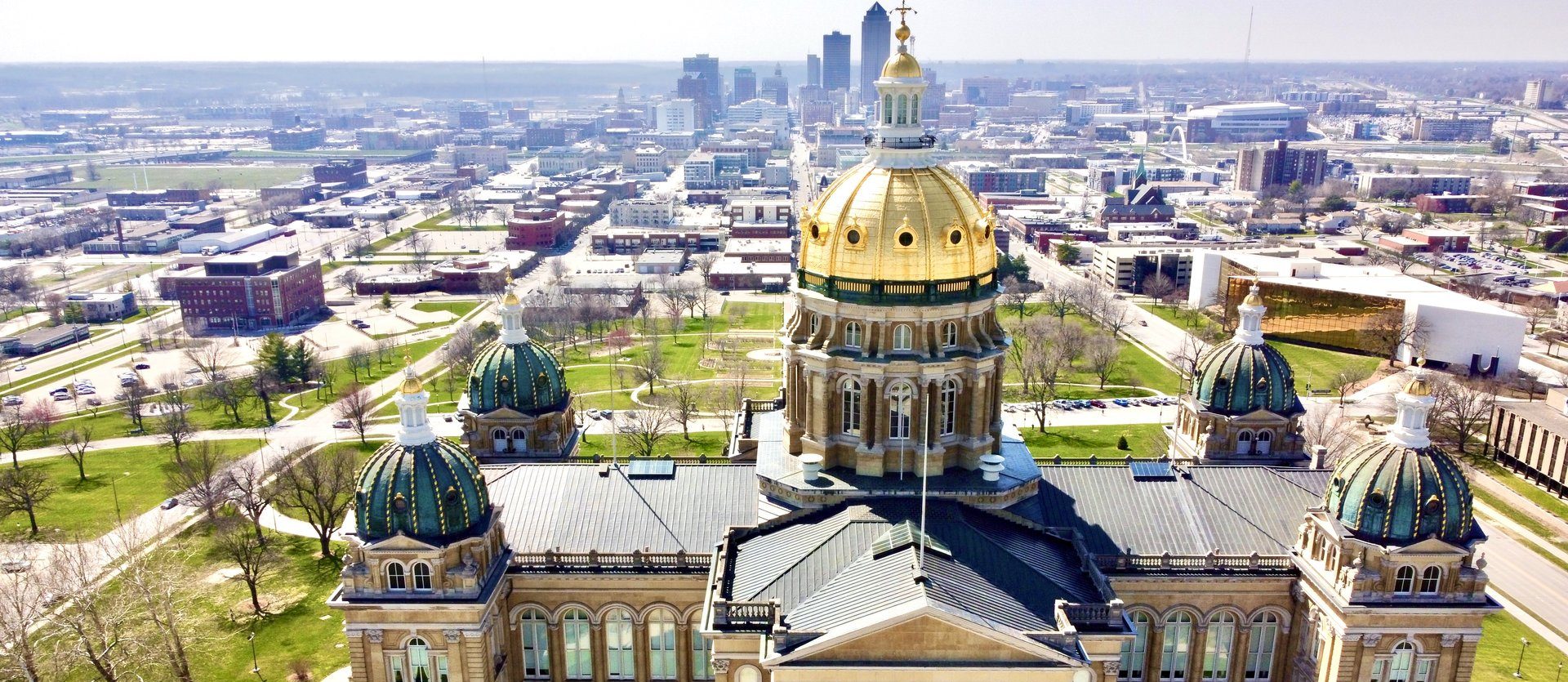 drone shot of iowa capitol buidling and downtown des moines