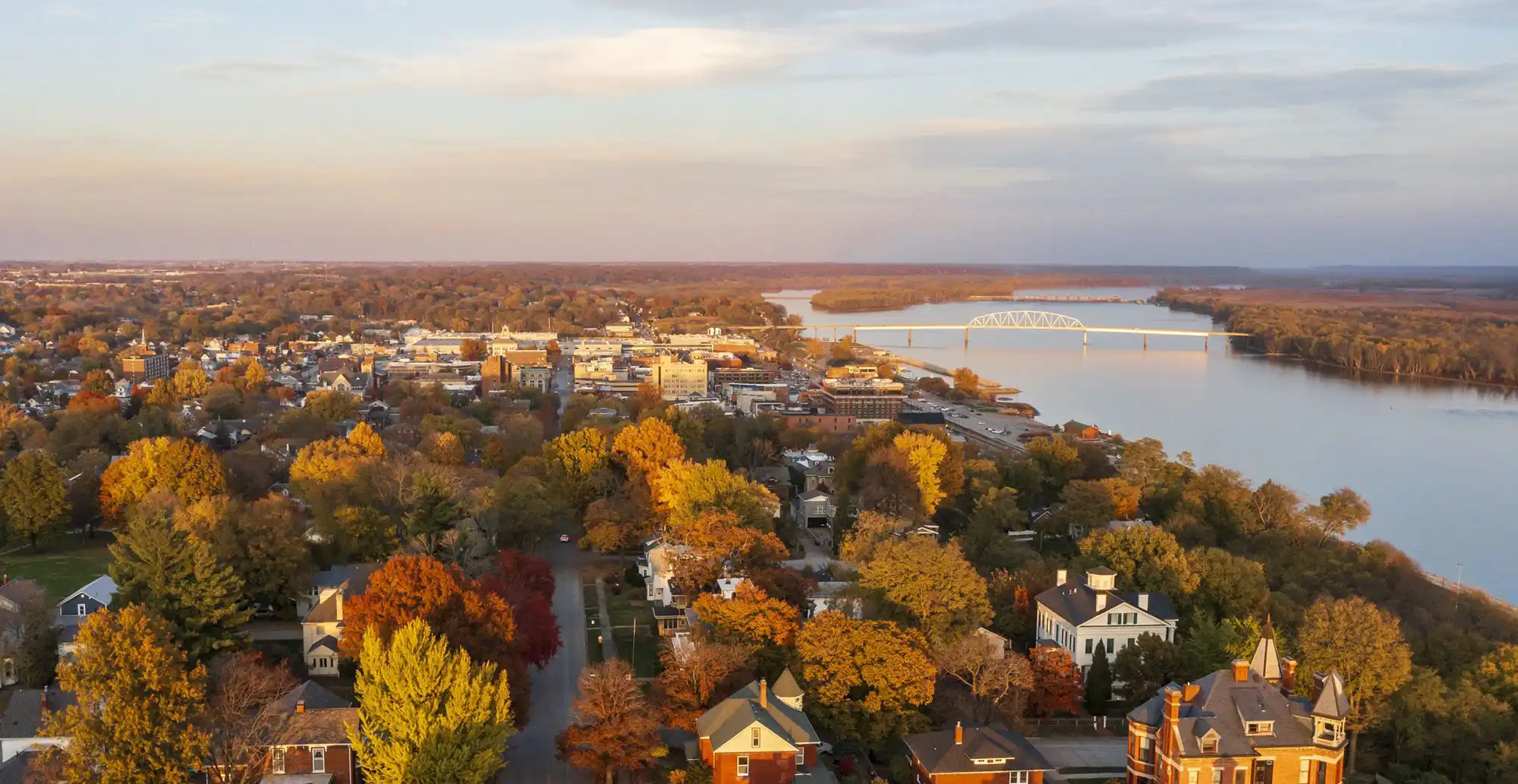 Overhead drone shot of Muscatine Iowa skyline with fall colors