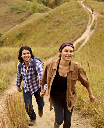 Two people walking up a hiking trail in Iowa