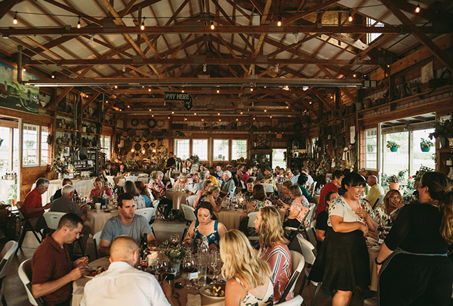 People dinning indoors at Harvestville Farms