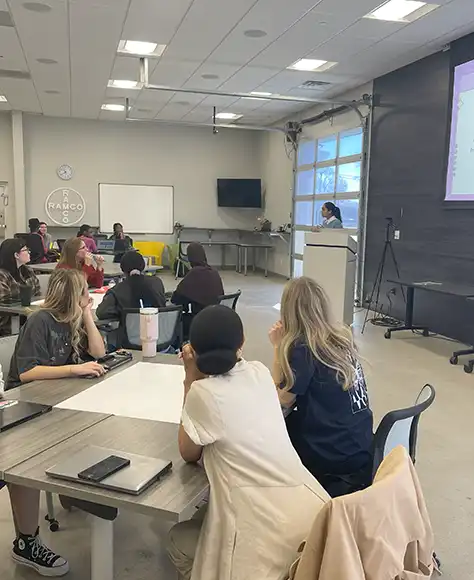 a group of Pi515 students listening to their instructor.