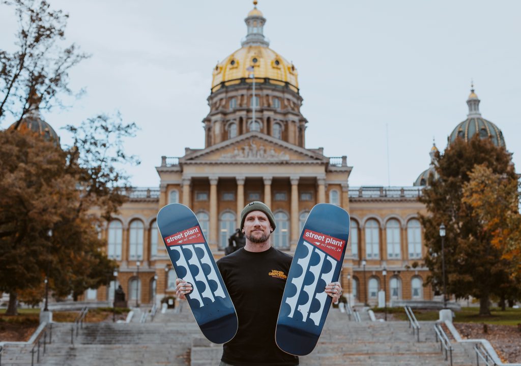 man holding skateboards