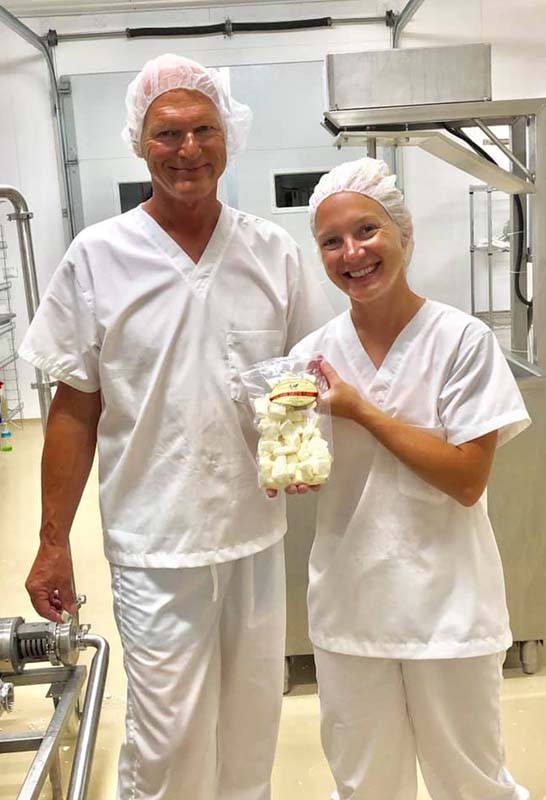 Ralph and Shannon Krogmeier holding their first-ever batch of cheese curds