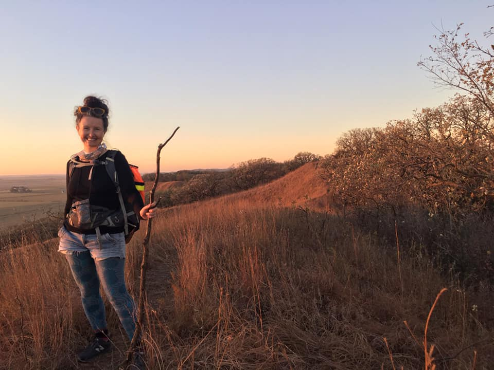 Kelly Madigan poses in Iowa's Loess Hills