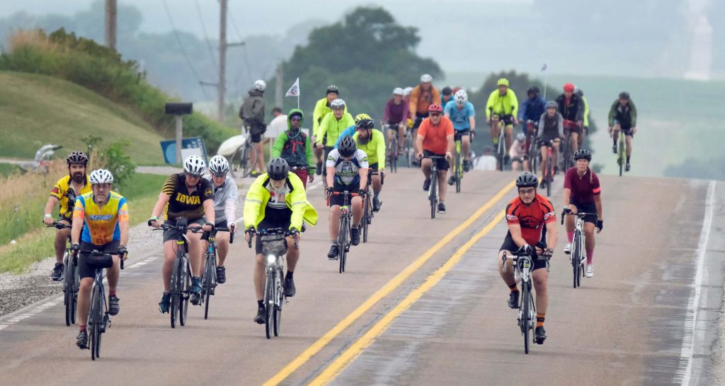 group of bicyclists on highway