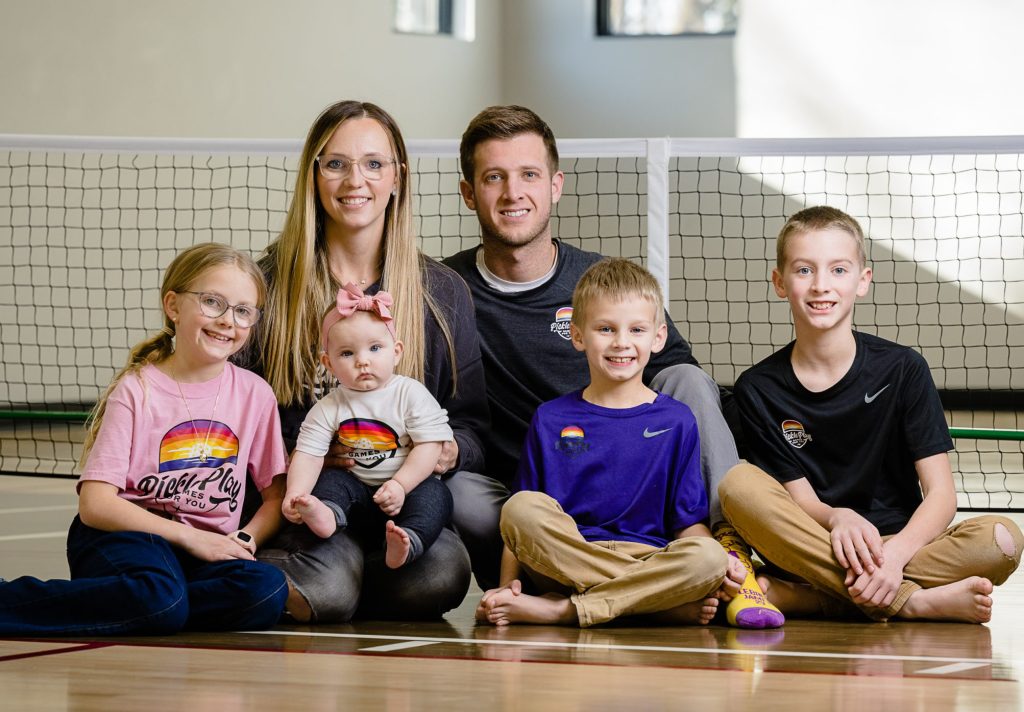 Family portrait inside gymnasium