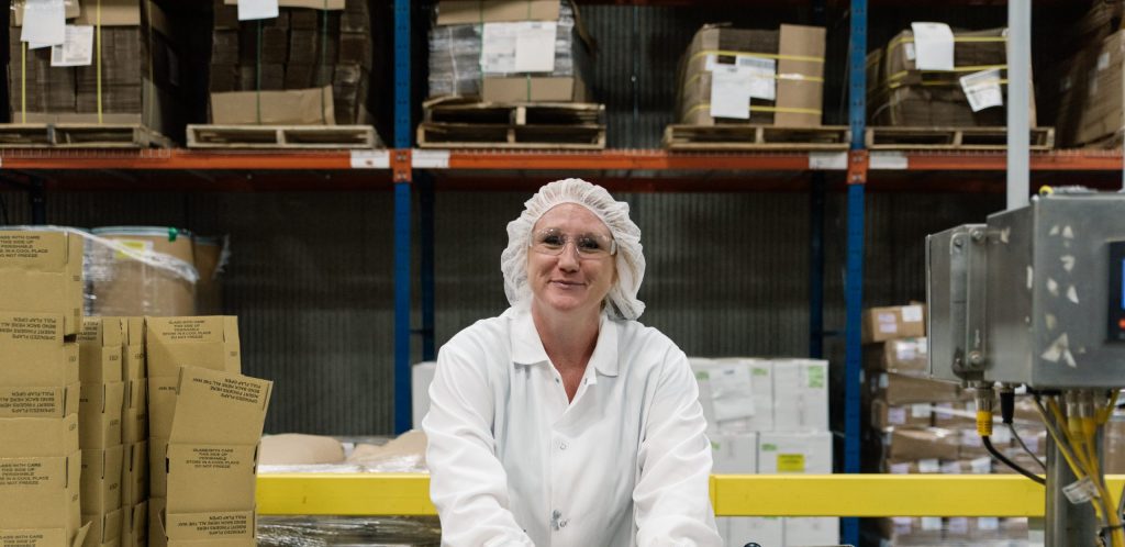 woman works in spice distribution warehouse