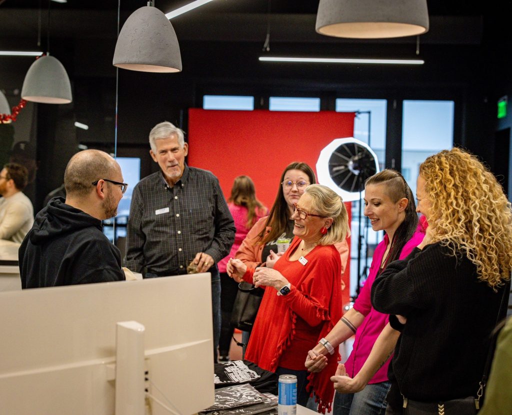 group conversing in office