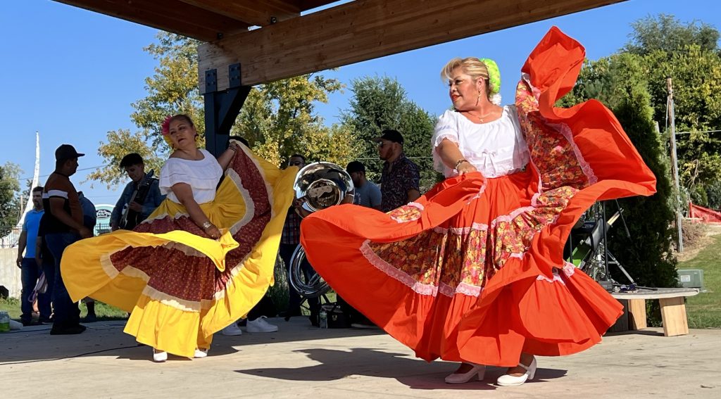 women dancing in cultural dresses