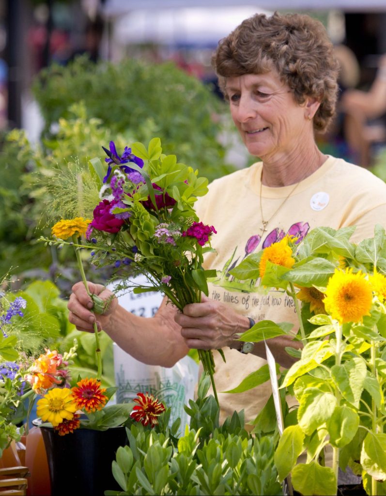 woman picking out flowers