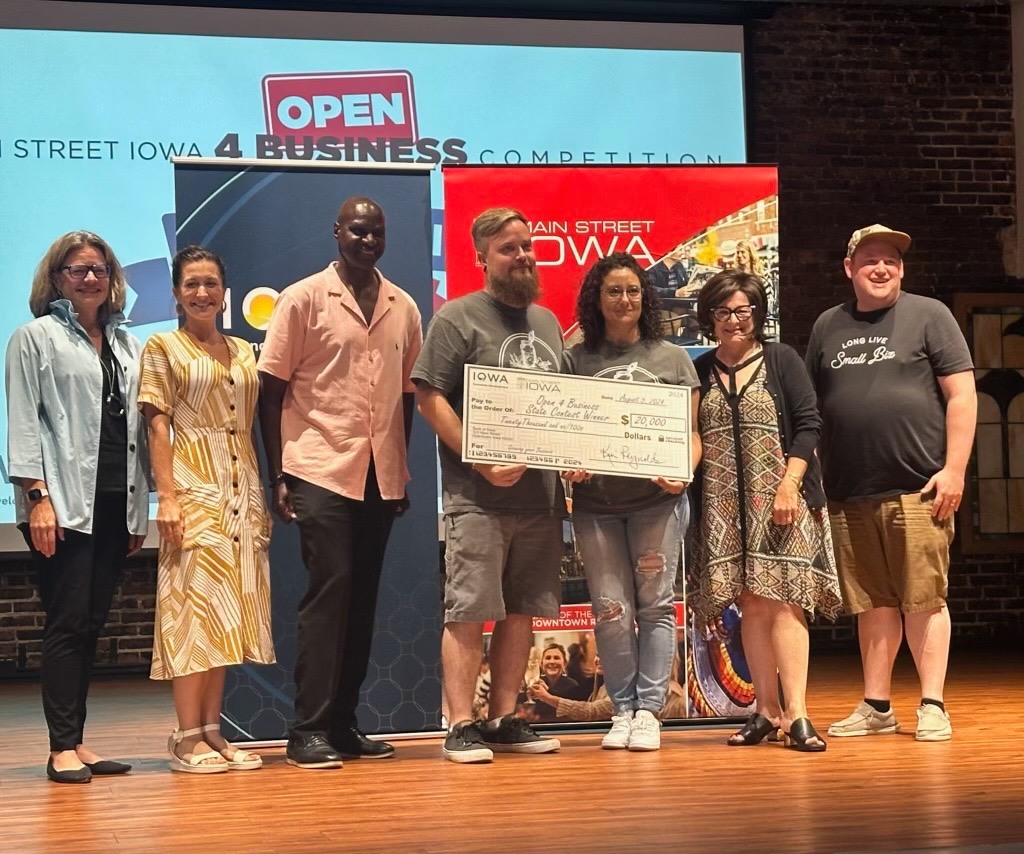 group with oversized award check