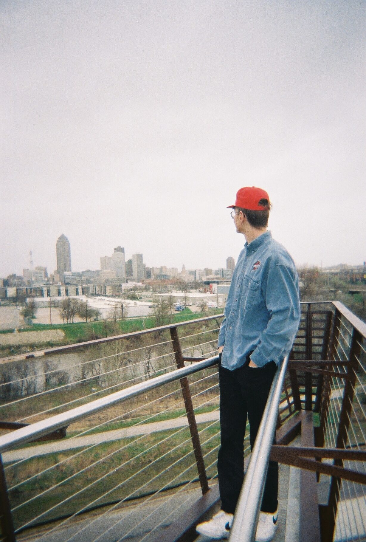 Isaac Jarnigan standing at a scenic overlook in des moines, iowa